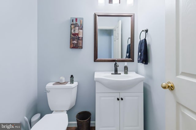 half bath with vanity and toilet