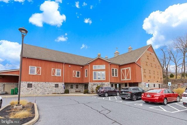 view of property featuring uncovered parking