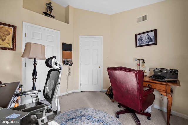 home office featuring carpet floors, baseboards, and visible vents