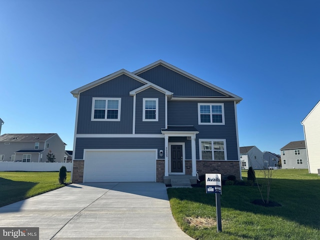 craftsman house featuring driveway, stone siding, an attached garage, fence, and a front yard