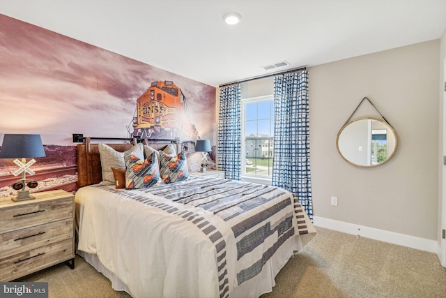 carpeted bedroom featuring visible vents and baseboards