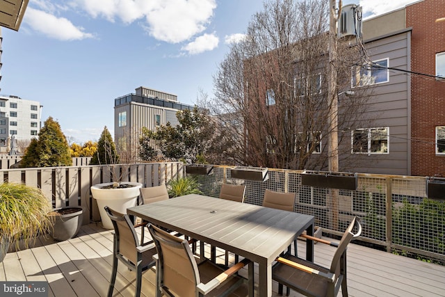 wooden deck with outdoor dining area