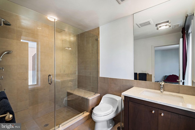 full bath with toilet, a stall shower, visible vents, and vanity