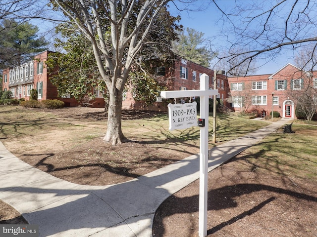 surrounding community featuring a yard