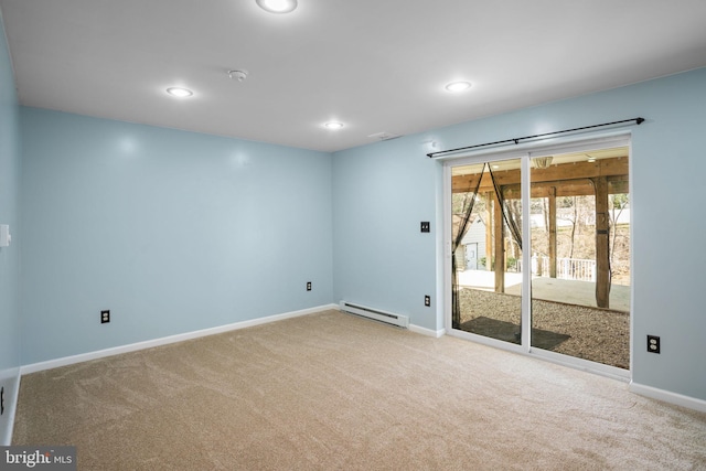 carpeted empty room with recessed lighting, baseboards, and baseboard heating