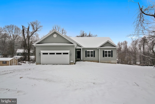 ranch-style house featuring a storage shed, an attached garage, and an outdoor structure