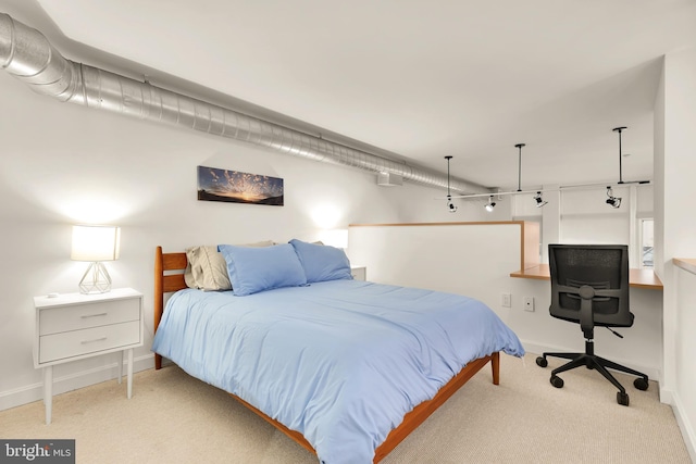 carpeted bedroom with baseboards