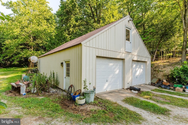 detached garage featuring driveway