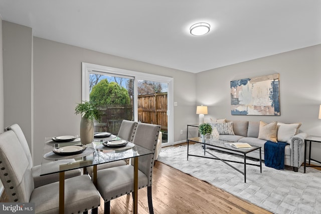 dining room with wood finished floors and baseboards