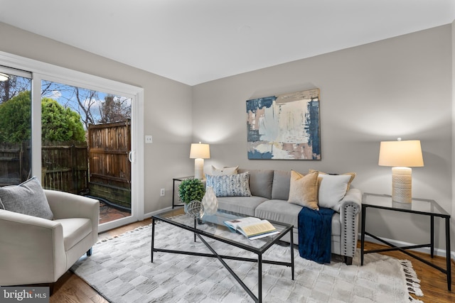 living room with wood finished floors and baseboards