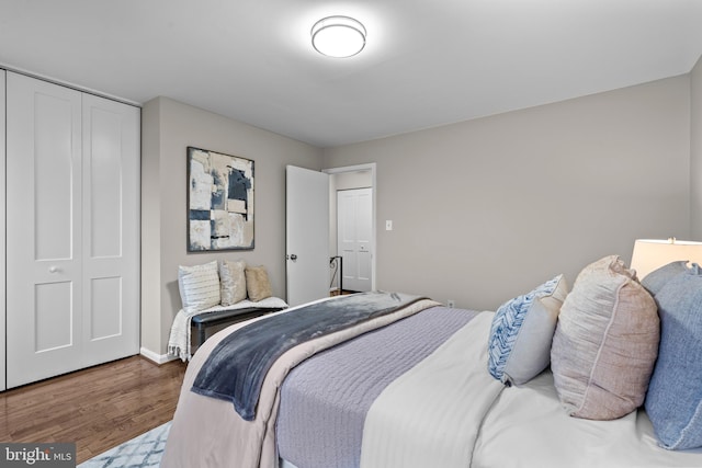 bedroom featuring a closet and wood finished floors