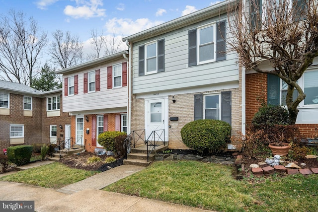 multi unit property featuring brick siding