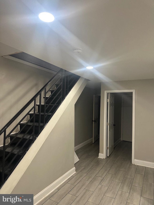 interior space featuring wood finish floors and baseboards