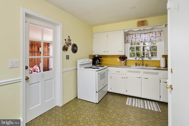 kitchen featuring a sink, dark floors, white cabinetry, and white electric range