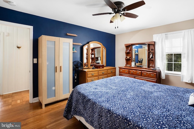 bedroom featuring ceiling fan and wood finished floors