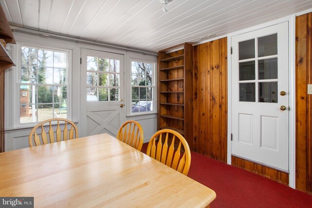 dining space featuring wood ceiling