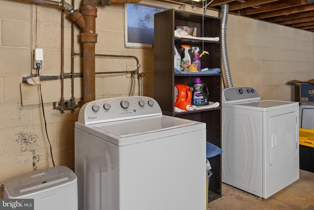 washroom featuring washer and dryer and laundry area