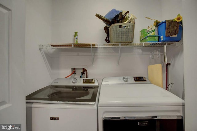 washroom with washer and dryer and laundry area