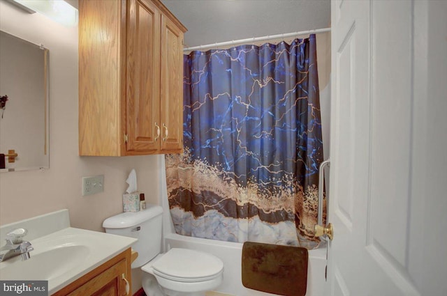 full bathroom featuring toilet, vanity, and shower / tub combo with curtain