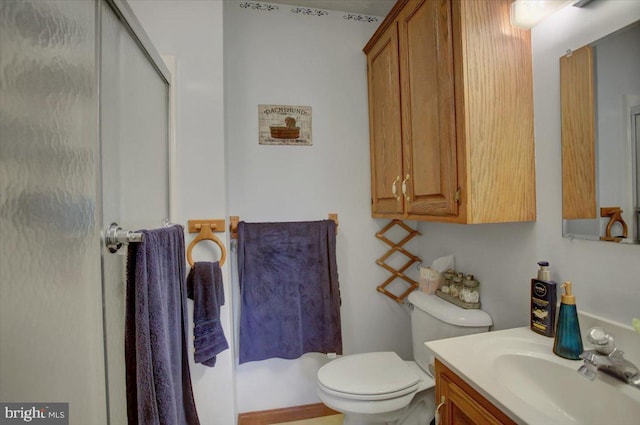 full bathroom with an enclosed shower, toilet, and vanity