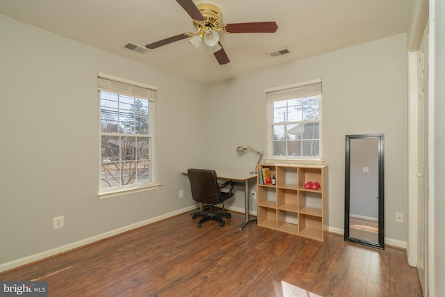 office area with hardwood / wood-style flooring, baseboards, visible vents, and ceiling fan