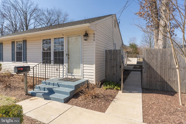 view of front of house featuring fence