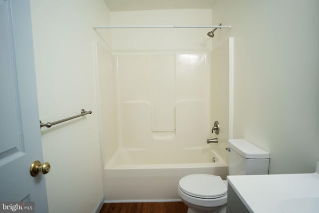 full bath featuring shower / bath combination, vanity, toilet, and wood finished floors