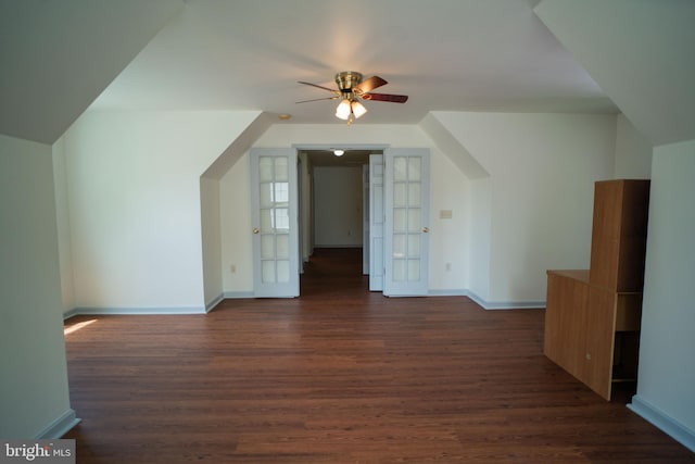 bonus room with ceiling fan, dark wood finished floors, and baseboards