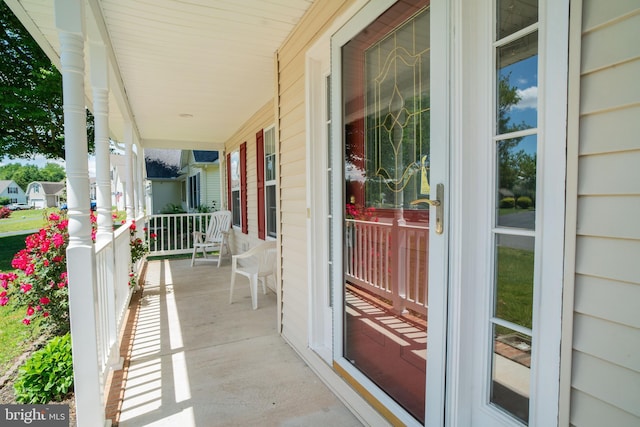 exterior space with a porch and a sunroom