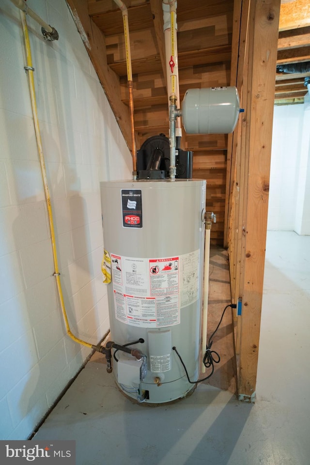 utility room featuring water heater