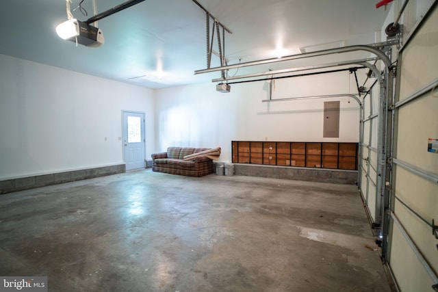 garage with electric panel and a garage door opener