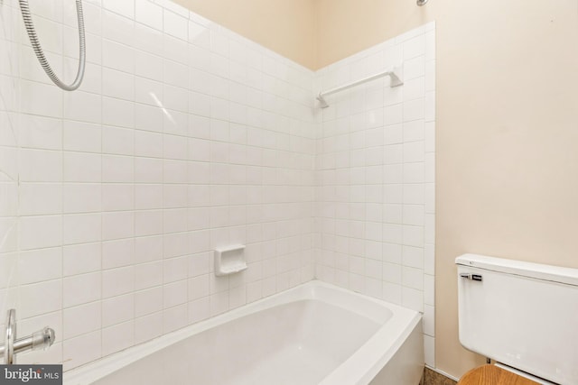 bathroom with shower / washtub combination and toilet