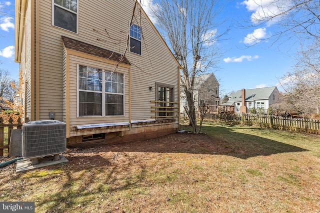 view of yard featuring cooling unit and fence