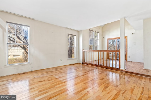 spare room with visible vents and wood finished floors