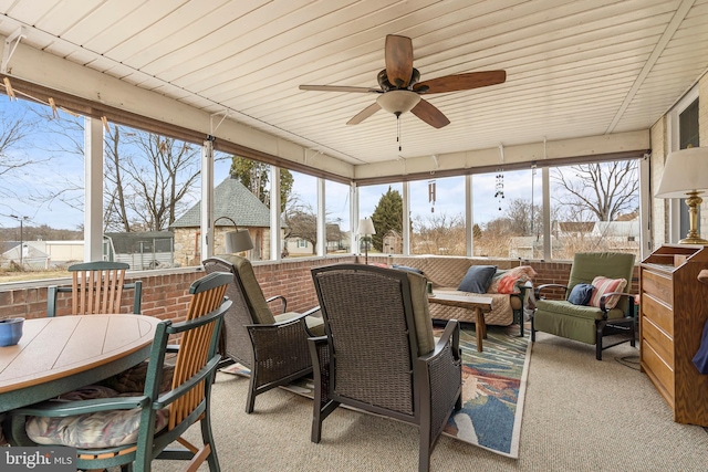 sunroom with plenty of natural light and ceiling fan