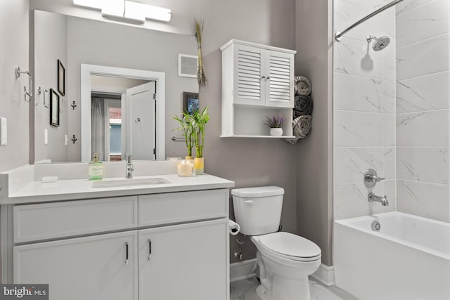 full bath featuring marble finish floor, shower / bath combination, toilet, vanity, and baseboards