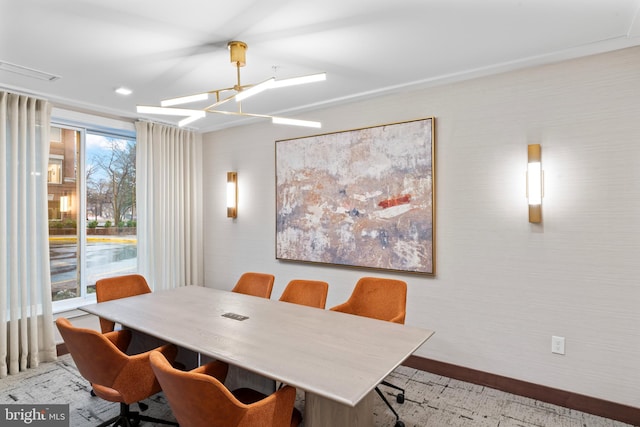 dining area featuring baseboards