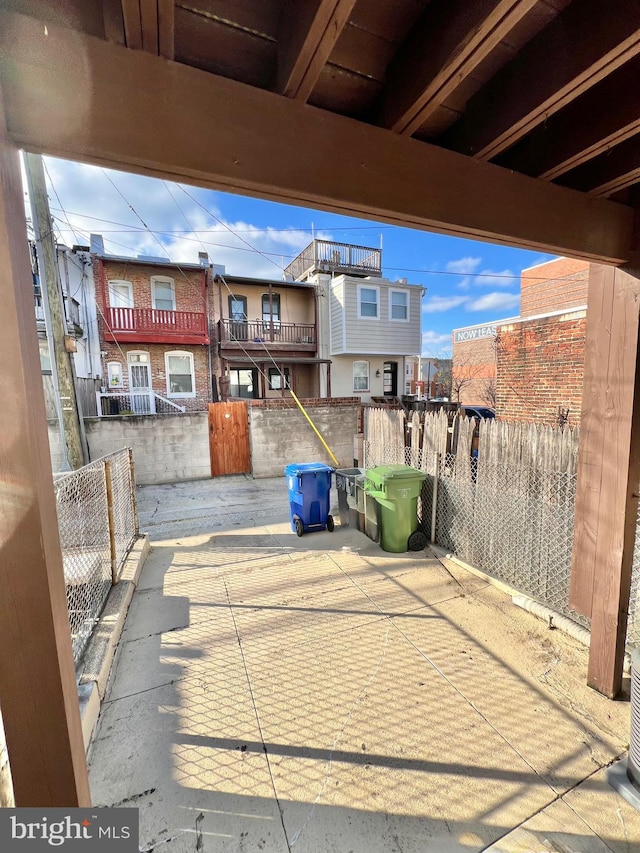 view of patio featuring fence