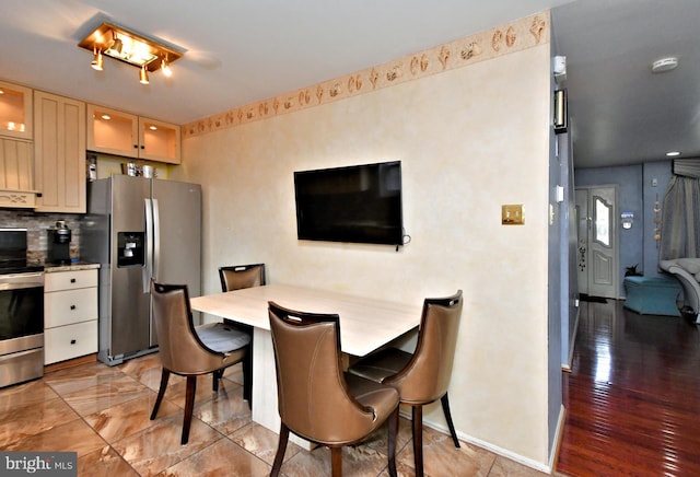 dining area featuring baseboards