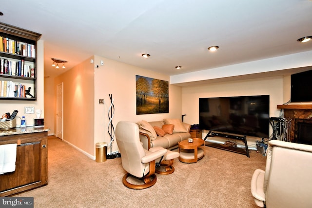 living room featuring light carpet and baseboards