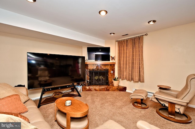 carpeted living area featuring recessed lighting, visible vents, and a fireplace