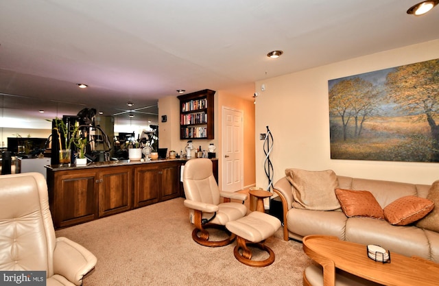 living room with light carpet and a bar