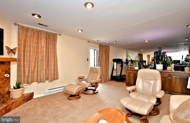 living area with carpet floors, a baseboard heating unit, visible vents, and recessed lighting