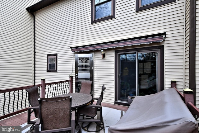 wooden deck featuring outdoor dining space