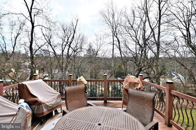 wooden deck featuring outdoor dining space