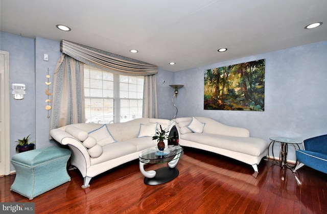 living area featuring wood finished floors and recessed lighting