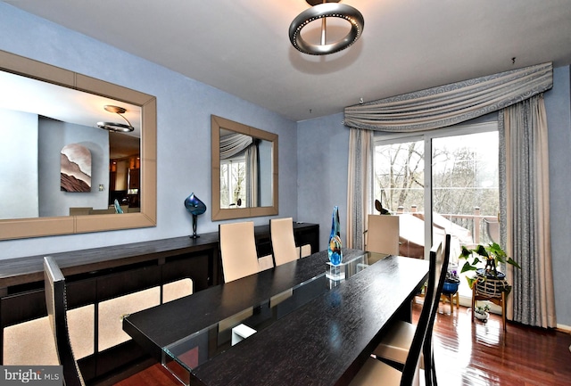 dining area with a healthy amount of sunlight and wood finished floors