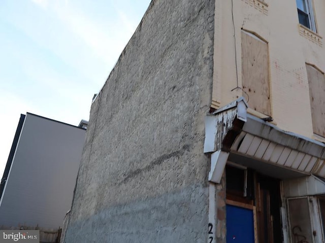 view of side of home featuring stucco siding