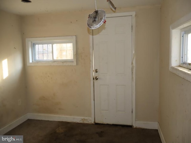 interior space with plenty of natural light and baseboards