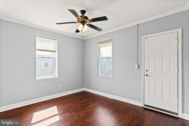 unfurnished room featuring a healthy amount of sunlight, dark wood-style floors, and baseboards